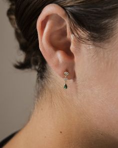 Make a statement with these Mae Drop Studs: dainty earrings with a drop design and an emerald accent for that extra sparkle. All eyes will be on you in these timeless earrings! Make a lasting impression with these on-trend drop studs. Materials: 14K gold plated sterling silver or sterling silver, cubic zirconia Features: 0.6" drop, 0.1" width, 2-3.75mm stones, Lead & Nickel free, post back Emerald Bridal Earrings, Silver Teardrop Earrings, Emerald Wedding Jewelry, Whimsical Earrings, Simple Silver Earrings, Stud Drop Earrings, Timeless Earrings, Silver Wire Earrings