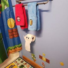 the bathroom is decorated in mario and luigi's house theme, including toilet paper rolls