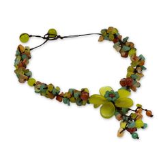 Glistening gems surround a serpentine flower in a hand-knotted necklace by Thailand's Nareerat. She selects a bright assortment of gems that include clusters of chip-cut serpentine, carnelian and dyed yellow-green quartz. Round carnelians and dyed quartz in yellow and greenish yellow are dotted throughout the brown necklace that can be adjusted to the desired length. Serpentine, carnelian, dyed quartz, waxed polyester cord Toggle clasp Handmade in Thailand Serpentine Necklace, Paw Print Jewelry, Hand Knotted Necklace, Ribbon Jewelry, Brown Necklace, Printed Jewelry, Green Quartz, Floral Necklace, Knot Necklace