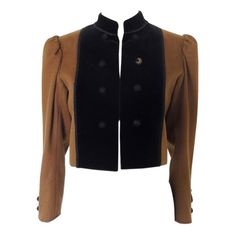 This is a vintage YSL Rive Gauche brown wool jacket. I believe this is a "Russian Collection" piece, late 1970s. The jacket has puff sleeves, Mandarin collar and black Passementerie trim. I believe this is wool with velvet paneling. The jacket is tagged size 36. Made in France. The jacket is in fair vintage condition. While the jacket body, trim, and velvet panels are in good condition, there are issues with several of the buttons and their net coverings. One cuff is missing one button, and the Retro Evening Outerwear For Fall, Retro Fall Evening Outerwear, Vintage Brown Wool Outerwear, Vintage Outerwear For Evening In Fall, Brown Long-sleeved Outerwear For Evening, Vintage Evening Blazer For Winter, Brown Long Sleeve Outerwear For Evening, Brown Long Sleeve Evening Outerwear, Brown Winter Evening Outerwear