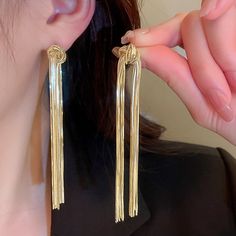 New Pair Of Gold Tone Tassels Earrings Metal Tassel Earrings As Gift, Chic Metal Dangle Tassel Earrings, Chic Metal Tassel Dangle Earrings, Party Tassel Dangle Earrings With Dangling Charms, Party Tassel Drop Earrings With Dangling Charms, Elegant Gold Metal Tassel Earrings, Party Drop Tassel Earrings With Dangling Charms, Elegant Gold Tassel Earrings, Metal Tassel Drop Earrings For Pierced Ears