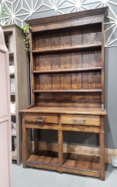 an old wooden desk with drawers and shelves