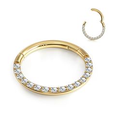 a pair of gold hoop earrings with white stones on the bottom and an earring in the middle