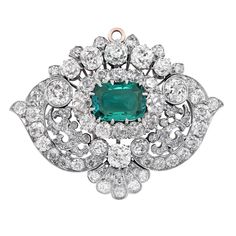 Signed Tiffany & Co. This Scroll Motif Emerald & Diamond Pendant contains a rare AGL Graded 2.85 Carat CLASSIC COLOMBIA Emerald surrounded by approximately 11.8 carats of old mine cut diamonds set in platinum. The pendant is estimated as being circa 1880. It is accompanied by a GIA Certified Natural Salt Water Pearl necklace, measuring 20 inches in length, which separates into two sections which allows it to be worn as a choker or two bracelets. The necklace is estimated as being circa 1915, Further details: There are 105 old mine cut diamonds on pendant. The diamonds average H color Vs- Si clarity (graded while mounted). The necklace has 344 natural pearls and 108 mix cut diamonds. Pin Necklace, Water Pearl Necklace, Pearl And Diamond Necklace, Diamond Brooch, Tiffany And Co, Gorgeous Jewelry, Diamond Design, Emerald Diamond, Tiffany & Co.