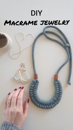 a woman's hand next to some jewelry on a white surface with the words diy macrame jewelry