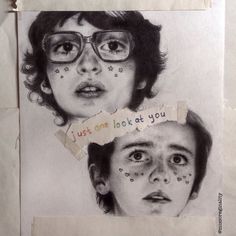 two children's faces are shown with torn paper and words written on the face