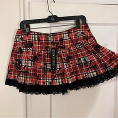 Nwt - Current Mood Lust Or Envy Red & Black Plaid Mini Skirt - L Dolls Kill X Current Mood This Mini Skirt Has A Plaid Pattern With Devilish Icons Skulls Bones Barbed Wire And Safety Pins Printed All Over, A High-Waisted Fit, Lace Up Sides, Pleated Details, Side Zip And Lace Trim Along The Hem. Measurements: Waist - 32” Length - 13” Sold Out Dead Stock Gothic, Punk, Grunge, Goth, Plaid, Emo, Deadstock Mha Clothes, Scene Skirt, Ropa Dark, Emo Skirt, Black Plaid Mini Skirt, Horror Protagonist, Pinterest Wardrobe, Grunge Skirt, Tartan Skirt