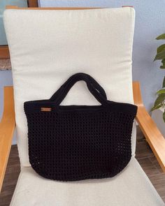 Black Crochet Tote Bag, Handmade Bag , Shoulder Shopping Bag, Summer Bag, Black Shoulder Beach Bag The handmade crochet tote bag / shoulder bag is very comfortable, practical, fashionable and stylish. It is unlined. It is a great gift for her. Measurements Width: 47 cm (18,5 in.) Height: 38 cm ( 15 in.) Handle Length: 56 cm ( 22 in.) According to the customer's request, work can be done with different colors ( 4 different colors or one color ) and sizes. For this reason, product returns are not Cheap Black Shoulder Bag For Beach, Affordable Casual Black Crochet Bag, Cheap Black Crochet Bag For Summer, Cheap Black Crochet Bags, Cheap Black Crochet Shoulder Bag, High-end Black Crochet Tote Bag, Affordable Handmade Black Crochet Bag, Expanded Form, Crochet Tote Bag