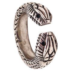 French Etruscan revival ring. Beautiful cuff ring, made in Paris France, circa 1970's. It was crafted in the Etruscan revival style with braided patterns in solid .925/.999 sterling silver with high polished finish. Featuring a pair of stylized snakes heads at the ends. Weight: 11.3 Grams, (7.24 Dwt). Size: The actual size is 6, can be sized. Hallmarks: Stamped with French marks; the mark of the crab for the assay and warranty of the silver, the maker's maitre mark Ste. AO and the retailer mark Silver Vintage Snake Ring, Unique Silver Rings With Antique Finish, Vintage Silver Open Snake Ring, Handmade Vintage Silver Snake Ring, Golden Goat, Large Bracelet, Small Bracelets, Cuff Ring, The Crab