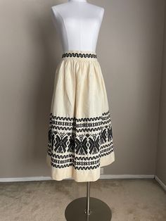 One of the most beautiful skirts I've come across. Incredible embroidery. *waist total: 26"-  but best fits a 25" for room to breathe *hips: free *length: 31.5" *no flaws to note- it's a linen or linen blend - thick linen *by Pelux, Guatemalan made *has a metal zipper, along with a button, and hook and eye closure *circa 1950s All you need is a blouse, or tank top and sandals, and you're good to go for this amazing ethnic skirt. *ALL SALES FINAL* Vintage White Gathered Skirt Bottoms, Vintage White Lined Skirt, Vintage Full Skirt Bottoms In Beige, Vintage Beige Full Skirt Bottoms, Vintage Cream Lined Skirt, Vintage White Full Skirt, White Vintage Gathered Skirt, Vintage White Gathered Skirt, White Vintage Skirt With Gathered Detail