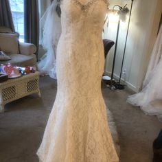 a wedding dress on display in a bridal room