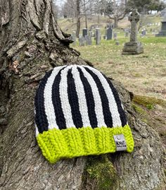 "Fitted super bulky luxury wool knit hat with bright green brim and vertical black and white stripes.  This hat is made using 100% ethically sourced wool. The wool used is sourced from brands that use free range shepherding, dye their yarns using environmentally friendly methods, and do not practice mulesing. Most wools used are REACH or Oekotex certified for their dyes. These fibers are biodegradable and do not contain micro plastics.  The Knit and the Pendulum tag is made from cork leather, an Micro Plastics, Wool Knit Hat, Wool Hat Knit, Super Bulky, Free Range, Wool Knit, Skull Cap Beanie, Design Luxury, Wool Hat