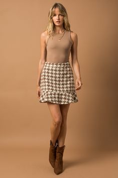 This skirt is absolutely adorable and such a statement for fall/winter! Houndstooth is such a trend right now and we are here for it. This skirt also has a friend...check out the matching jacket that you could pair with it! Chic Ruffled Skirt Bottoms For Fall, Chic Tiered Skirt For Fall, Trendy Winter Houndstooth Skirt, Winter Trendy Houndstooth Skirt, Chic Ruffled Fall Skirt, Chic Fall Ruffled Skirt, Trendy Brown Mini Skirt For Fall, Fitted Tiered Mini Skirt For Fall, Trendy Brown Fall Mini Skirt