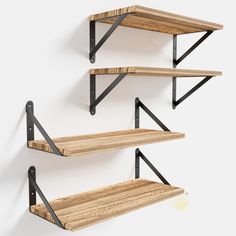 three wooden shelves with metal brackets on them