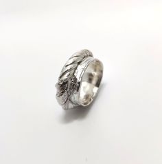 One of a kind ring made by using Japanese mitsuro hikime casting technique.  This technique creates very organic, rustic and unique fluid-like pattern on the ring. The material is hallmarked sterling silver. NOTE, measurements vary due to the organic shape of the ring. The ring can be stretched 1-2 sizes if required, but cannot be made smaller, as the unique pattern would get damaged. Diameter approximately 17 mm,  width 7mm-11mm,  thickness 4mm-6mm Size chart: Ireland/UK/AU/NZ: O 1/2 - P Europe Organic Shapes, Silver Band, Rings Statement, Unique Patterns, Sterling Silver Ring, Favorite Jewelry, Statement Rings, Silver Ring, Sterling Silver Rings