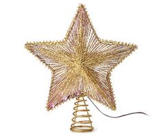 a gold christmas tree topper with a spiral wire star on it's side