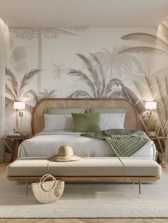 a bedroom with palm trees on the wall and a bed in the foreground,