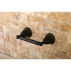 two black handles on a brick wall