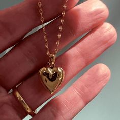 A romantic and timeless locket in a modern, dainty silhouette. The functional heart locket hangs upon a delicately twisted chain. Versatile enough to simply be worn solo or layered as the perfect compliment to your favorite necklaces. Adjustable between 18-21". Locket measures 1/2". Do you plan on adding a photo? Please see our handy locket template here. Our materials make for an amazing, high quality, seamless, jewelry piece with longevity. Our necklaces are plated with 18k gold, 18k rose gold Heart Shaped Dainty Locket Necklace With Delicate Chain, Dainty Heart Pendant Locket Necklace With Delicate Chain, Dainty Heart Locket Necklace With Delicate Chain, Dainty Heart Charm Locket Necklace, Dainty Locket Necklace For Everyday, Dainty Heart Pendant Locket Necklace With Charm, Dainty Heart Locket Necklace With Charm, Dainty Double Heart Locket Necklace With Charm, Dainty Locket Necklace With Delicate Chain