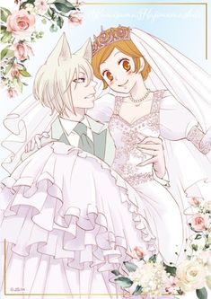 two people dressed in wedding clothes and holding each other