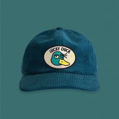 Drew this weird little duck dude and thought I'd throw him on a patch! Embroidered directly onto sturdy canvas, then machine sewn onto a super soft corduroy hat, that's sure to become your new favorite. Please note: these hats are somewhere in between a flat bill and a curved bill. The brim can bend quite a bit to suite your preference. Hat specs: Lower profile, unstructured six panel Adjustable fastener with metal clasp, tonal under-peak lining Mid weight Flat Peak 100% cotton One size fits all Corduroy Hat, Lucky Duck, Hat Fits, Little Duck, It's Hard, One Size Fits All, Bend, Sewing, Hats