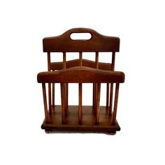 a wooden chair with two chairs on it's legs and one seat folded back