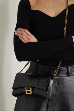 Balenciaga's 'Hourglass' bags are inspired by the label's sculptural blazers. This shoulder bag has been crafted in Italy from smooth leather and detailed with a brushed gold-tone 'B' at the front flap. The interior has multiple card slots, a zipped compartment and a handy pocket for your phone or keys. Detach the chain strap to hold it as a clutch. Luxury Sleek Baguette Bag For Formal Occasions, Luxury Elegant Baguette Bag With Multiple Compartments, Elegant Luxury Baguette Bag With Multiple Compartments, Luxury Rectangular Baguette Bag For Business, Luxury High-end Women's Baguette Bag, Balenciaga Hourglass Bag Nude, Luxury Black Baguette Bag With Multiple Compartments, Luxury Black Baguette Bag With Metal Hardware, Balenciaga Hourgkass Bag