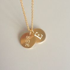 "Beautiful and charming, this double gold disc necklace is simple yet stunning. I diamond etch engrave your initial on one charm and a date on the other. Each disc charm is made from 14k gold fill and is approximately 12.5mm in diameter. A sturdy 14k gold fill chain and spring ring clasp is used. Please make sure to select your desired length in the drop down menu. In addition, please make sure to let me know what initial and date you would like to have engraved in the \"note to seller\" field u Gold Name Necklace With Round Pendant For Anniversary, Gold Name Necklace With Round Pendant, Personalized Gold Necklaces For Anniversary Gift, Gold Hand Stamped Charm Necklaces For Wedding, Gold Name Necklace With Round Pendant For Wedding, Gold Round Pendant Name Necklace For Wedding, Minimalist Round Disc Initial Necklace For Anniversary, Gold Engraved Initial Necklace, Minimalist Round Disc Charm Necklace For Anniversary