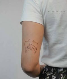 a person with a small tattoo on their arm