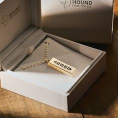 An expertly crafted dog memorial pendant. Made from approx. 23 grams of solid 18K gold, our personalised ingot-style pendants are a testament to the unbreakable bond between man and his best friend.  Inspired by the adventures we share, the hard times we endure, and the everyday moments we cherish while they're here. And fondly remember when they're not. A unique symbol of connection: - A triangle, the strongest shape, represents the strength of the bond. - A paw-in-hand marks the trust & loyalty shared. - And a compass signifies their guidance. The final two symbols are custom engraved, making the piece unique to the owner and their dog. - The year they came into the owner's life. Because from that moment on, their lives changed forever. -And finally, their dog's initial. (Please take car Dog Loss, Unique Symbols, Memorial Pendant, Personalized Pet Memorial, Loss Of Dog, Pet Memorial Gifts, 18k Gold Jewelry, Everyday Moments, Dog Memorial