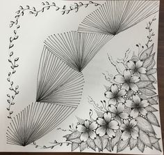 a drawing of flowers and leaves on paper