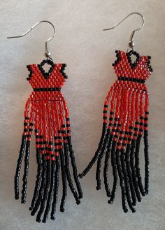 red and black beaded earrings on white background