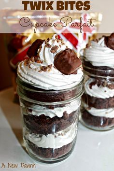 two jars filled with brownies and whipped cream