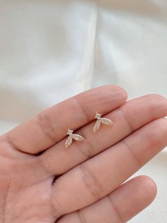 ♥ Find more designs here: https://www.etsy.com/shop/SaninJewelry ♥ Also, you can follow us on Instagram: https://www.instagram.com/saninjewelry ♥ Order $35 USD get FREE standard shipping within the USA. International rates change depending on location. 14K Gold Tiny Whale Earrings - Dainty Stud Earrings - Tiny Stud Earrings - Whale Tail Stud Earrings - Whale Earrings - Gift For - Gift for her - Best Friend Gift - Delicate Earrings - Animal Jewelry DETAILS ♥ Materials: 14k Gold filled. ♥ Gold filled Bee stud earrings. ♥ Micro pave CZ stones on studs' top. ♥ It does not harm your skin. PACKAGING ♥ All pieces come in a special bag, beautifully designed to keep your jewelry safe from scratches and perfect for gift giving. GIFT OPTION ♥ Is it a gift? Let us know and we will include a little gif Leaf-shaped Earrings As Gift, Ocean Inspired Earrings, Whale Earrings, Skin Packaging, Gold Whale, Bee Studs, Earrings Nature, Jewelry Details, Nature Earrings