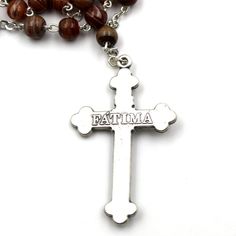 Features: Warm brown color with swirl effect on beads Medallion with Fatima and Fatima dirt on the back Rosary measures 18.5" Diameter of the beads: 6 mm Made in Fatima, Portugal Product Description: Celebrate our Lady of Fatima with this beautiful brown beads rosary. Hand made in Fatima, Portugal, this rosary is a great way to commemorate Our Lady of Fatima. A classic handmade rosary and Fatima medallion to commemorate Mary's apparition in Fatima, Portugal. Brown Beaded Rosary As Gift, Beaded Brown Rosary Gift, Brown Beaded Rosary Gift, Brown Beaded Rosary With Cross Shape, Brown Beaded Spiritual Rosary, Brown Beaded Cross Rosary, Brown Beaded Cross-shaped Rosary, Fatima Portugal, Lady Of Fatima