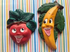 two fruits and vegetables with faces painted on them