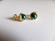 This listing is for round Malachite stones wire wrapped in gold filled wire They are natural stones, green color with stripes, as it's usual for these gemstone. The earring have butterfly backs that are gold filled The gemstones measure approximately 8 mm You will receive the exact earrings of the photos. the butterfly stopper are gold filled Green Wire Wrapped Round Earrings, Green Hand Wrapped Earrings As Gift, Green Hand Wrapped Earrings For Gift, Hand Wrapped Green Earrings For Gifts, Malachite Stone, Paper Gift Box, Wire Rings, Wire Wrapped Earrings, Mala Beads