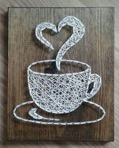 a string art coffee cup with a heart on it