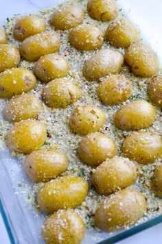 some food is sitting in a glass dish on a counter top, ready to be eaten