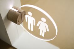 a bathroom door with a toilet paper dispenser on it