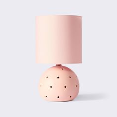 a pink table lamp with stars on it