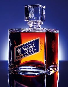 a bottle of blue label whiskey sitting on top of a table