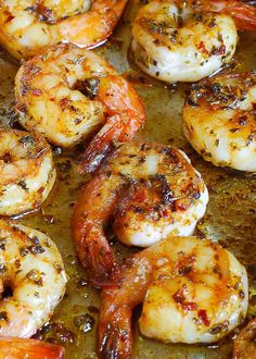 cooked shrimp with herbs and seasoning in a pan