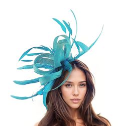 Hats By Cressida Kentucky Derby & Ascot Fascinator Hats Dark Turquoise Melik Feathers & Sinamay Fascinator Beautiful dark turquoise sinamay loops and turquoise coque feathers fascinator Body Measures about 7-8 Inches wide, with feathers about 22 inches wide Mounted with a matching headband. If you prefer a headband to match your hair, please make a note at check out what colour headband you want. Are you looking for the perfect headpiece for your upcoming formal event or special occasion? Our Melik Sinamay & Feathers Fascinator Hat is a great choice if you want a fascinator hatfor such occasions as the Kentucky Derby, Royal Ascot, Ladies Day, races or a wedding. Whether you wear it to a church service, cocktail party, or formal occasion, this hat is sure to make a statement. We make each h Royal Blue Fascinator, Garden Cocktail, Statement Hat, Tea Hats, Blue Fascinator, Sinamay Fascinator, Wedding Fascinators, Feather Fascinators, Kentucky Derby Hat