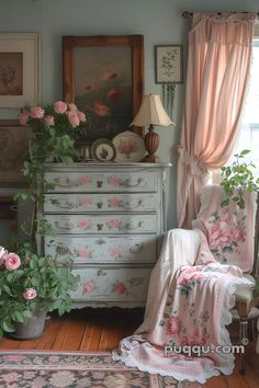 an old dresser with pink flowers on it in a living room next to a window