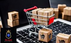 a shopping cart sitting on top of a laptop computer surrounded by boxes and cubes