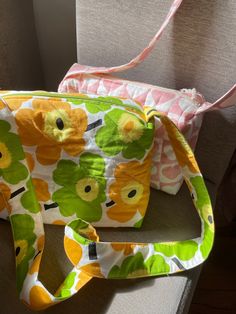 Quilted Crossbody bag. Handmade Floral Printed Handbag. Yellow Green. Pink White. Fleece lining. Cotton outer fabric. - Zippered - Inside pockets, both sides (2-small-pocket, 1-large-pocket) Size pink and white 8cm x 16cm x 25cm, strap 118cm x 3.5cm green and yellow 8cm x 19cm x 25cm, strap 110cm x 4.5cm Retro Crossbody Shoulder Bag With Pockets, Retro Crossbody Bags With Pockets, Retro Rectangular Fabric Bag, Vintage Cotton Crossbody Bag, Retro Multicolor Bags With Pockets, Reversible Fabric Shoulder Bag, Everyday Retro Bag With Zipper Pouch, Retro Everyday Bag With Zipper Pouch, Retro Everyday Bags With Zipper Pouch