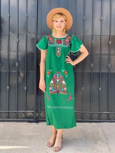 "Floral embroidery artisanal mexican dress, GREEN bohemian kaftan, mexican wedding guest outfit, south american resort wear, grandmacore Gorgeous vibrant floral hand embroidery and flowy fit make this beautiful boho GREEN Mexican maxi dress the perfect long summer kaftan or beach dress Cool and comfortable Mexican long dress is great for everyday wear. Or dress it up for a dazzling night out. Short sleeves have feminine ruffles 100% Cotton. The perfect resort wear for travel Measurements taken f Green Bohemian Kaftan For Festive Occasions, Green Floral Embroidered Maxi Dress, Bohemian Embroidered Maxi Dress For Traditional Ceremonies, Bohemian Maxi Dress For Traditional Ceremonies, Green Embroidered Maxi Dress For Festive Occasions, Green Festive Embroidered Maxi Dress, Green Maxi Dress For Traditional Ceremonies, Spring Green Dresses With Embroidered Neckline, Green Dress With Embroidered Neckline For Spring