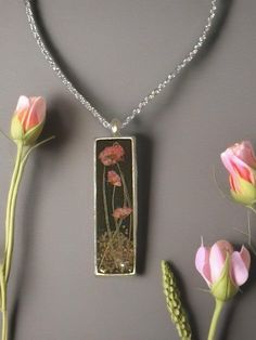 a necklace that has flowers inside of it