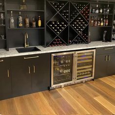 a wine cooler in the middle of a kitchen